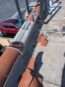 Home inspector in Ontario, CA performing commercial roof inspection