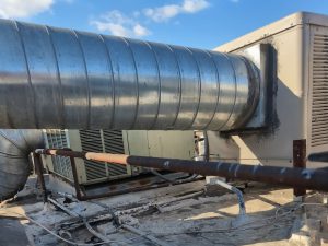 Commercial property inspector in Anaheim, CA performing roof inspection